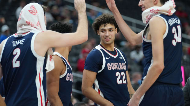 Nov 22, 2021; Las Vegas, Nevada, USA; Gonzaga Bulldogs forward Anton Watson (22) celebrates with Gonzaga Bulldogs forward Drew Timme (2) and Gonzaga Bulldogs center Chet Holmgren (34) during the second half against the Central Michigan Chippewas at T-Mobile Arena. Mandatory Credit: Stephen R. Sylvanie-USA TODAY Sports